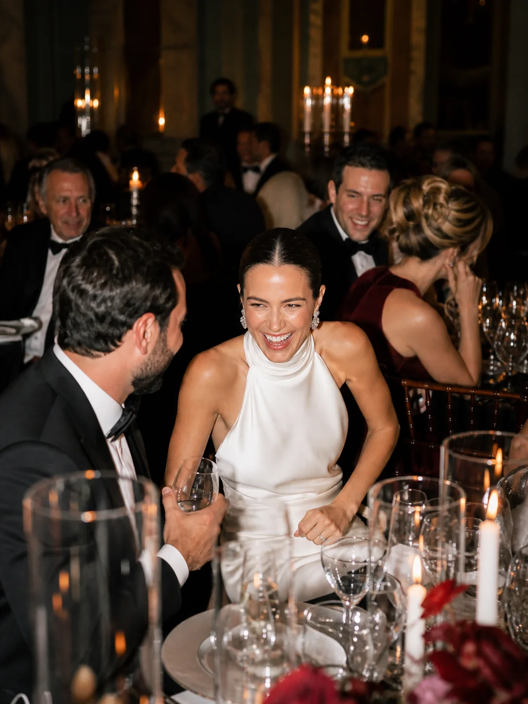 A candid moment at a black-tie wedding reception